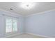 Light blue bedroom has a window with shutter and neutral carpet at 7924 Pemswood St, Charlotte, NC 28277