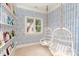 Charming bedroom with hanging swing chairs and built-in bookshelf at 7924 Pemswood St, Charlotte, NC 28277
