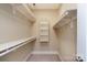 Walk-in closet provides ample storage with shelves and clothing rods at 7924 Pemswood St, Charlotte, NC 28277