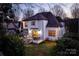 Inviting exterior of home featuring outdoor patio and screened porch, perfect for outdoor relaxation and entertaining at 7924 Pemswood St, Charlotte, NC 28277