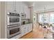 Modern kitchen features stainless steel appliances, granite countertops, and hardwood floors at 7924 Pemswood St, Charlotte, NC 28277