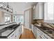 Gourmet kitchen with sleek appliances, granite countertops, and a convenient breakfast bar at 7924 Pemswood St, Charlotte, NC 28277