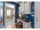 Home office with custom built-ins, granite counters, and natural light at 7924 Pemswood St, Charlotte, NC 28277