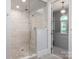 Modern glass shower with mosaic tiling, dual shower heads, and an adjacent walk-in closet at 7924 Pemswood St, Charlotte, NC 28277
