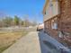 Spacious backyard with large concrete patio, partially fenced yard, and ample space for outdoor activities at 8103 Idlewild Rd, Indian Trail, NC 28079