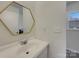 Modern bathroom features new sink, fixtures, and mirror with natural light at 8103 Idlewild Rd, Indian Trail, NC 28079