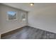 Modern bedroom features great natural light, modern floors and exterior door at 8103 Idlewild Rd, Indian Trail, NC 28079