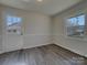 Bright dining room features modern floors, lots of natural light and back door at 8103 Idlewild Rd, Indian Trail, NC 28079