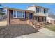 Charming two-story home with brick and siding exterior, featuring a well-maintained lawn and inviting entryway at 8103 Idlewild Rd, Indian Trail, NC 28079