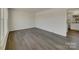 Bright, airy living room boasts modern flooring and ample natural light at 8103 Idlewild Rd, Indian Trail, NC 28079