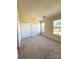 Bright bedroom featuring neutral carpet, double closets, and natural light from the large windows at 8224 Golf Ridge Dr, Charlotte, NC 28277
