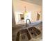 Stylish granite countertops with stainless steel sink and updated faucet at 8224 Golf Ridge Dr, Charlotte, NC 28277