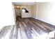 Bright living room featuring stylish flooring and neutral paint at 8224 Golf Ridge Dr, Charlotte, NC 28277