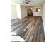 Spacious living room featuring hardwood flooring and a ceiling fan at 8224 Golf Ridge Dr, Charlotte, NC 28277