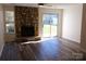 Bright living room with stone fireplace, offering a cozy and inviting atmosphere at 8224 Golf Ridge Dr, Charlotte, NC 28277