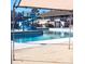 Community pool and water slide area with shade covering and multi-level sundeck at 8224 Golf Ridge Dr, Charlotte, NC 28277
