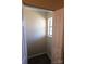 Bright walk-in closet with a window, offering ample storage space at 8224 Golf Ridge Dr, Charlotte, NC 28277