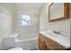 Traditional bathroom with a window, vanity, and bath tub, ready for updates at 836 Love Rd, Blackstock, SC 29014