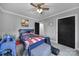 This bedroom features a bed with an American flag and motorcycle themed comforter and black door at 836 Love Rd, Blackstock, SC 29014
