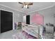Charming bedroom with a unique pink headboard, desk area and colorful accent rug at 836 Love Rd, Blackstock, SC 29014