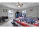 This cozy bedroom features two windows, a ceiling fan and a motorcycle themed bedspread at 836 Love Rd, Blackstock, SC 29014