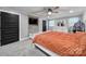 Bedroom features a modern accent wall, a ceiling fan, and neutral-colored walls and flooring at 836 Love Rd, Blackstock, SC 29014