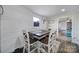 Bright dining area with a rustic wood table, stylish chairs, and shiplap walls at 836 Love Rd, Blackstock, SC 29014