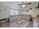 The living room boasts neutral walls, a ceiling fan and a large sectional sofa at 836 Love Rd, Blackstock, SC 29014