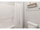 Bright bathroom features white tile walls and a shower-tub combo at 8513 Loxton Cir, Charlotte, NC 28214