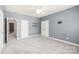 Primary bedroom featuring plush carpet and a ceiling fan at 8513 Loxton Cir, Charlotte, NC 28214