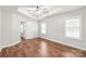 Bright bedroom offers hardwood floors, natural light, and a ceiling fan for comfortable living at 8513 Loxton Cir, Charlotte, NC 28214