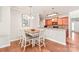 Cozy dining area adjacent to the kitchen featuring a wooden table and seating for four at 8513 Loxton Cir, Charlotte, NC 28214