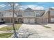 Townhome exterior with private garages, neutral paint and a well manicured front yard at 8513 Loxton Cir, Charlotte, NC 28214