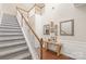 Bright foyer featuring a staircase, wood floors, and decorative furnishings at 8513 Loxton Cir, Charlotte, NC 28214