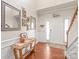 Inviting foyer with hardwood floors, decorative mirrors, and a wooden table at 8513 Loxton Cir, Charlotte, NC 28214