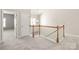 Hallway with a staircase and a decorative light fixture at 8513 Loxton Cir, Charlotte, NC 28214