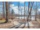 Lakefront retreat features outdoor seating for grilling and chilling by the water at 8513 Loxton Cir, Charlotte, NC 28214