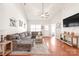 Inviting living room featuring a vaulted ceiling, hardwood floors, and comfortable seating at 8513 Loxton Cir, Charlotte, NC 28214
