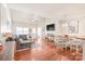 Open concept living room and dining area with hardwood floors and ample natural light at 8513 Loxton Cir, Charlotte, NC 28214