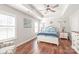 Serene main bedroom with a tray ceiling, hardwood floors, and natural light at 8513 Loxton Cir, Charlotte, NC 28214
