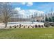 Community pool features a clubhouse, plenty of seating and lush landscaping at 8513 Loxton Cir, Charlotte, NC 28214