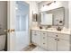 Bathroom features a double sink vanity with an oversized mirror, and neutral walls at 8929 Bryant Field Cir, Charlotte, NC 28277