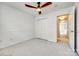 Bedroom features neutral carpeting, a ceiling fan, a closet, and access to the hallway at 8929 Bryant Field Cir, Charlotte, NC 28277