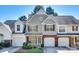 Charming townhome with a gray exterior, well-manicured landscaping, and attached one car garage at 8929 Bryant Field Cir, Charlotte, NC 28277