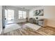 Bright foyer with wood floors, neutral paint, and a front door opening at 8929 Bryant Field Cir, Charlotte, NC 28277