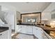 Kitchen featuring neutral tile floors, white cabinets, and stainless steel dishwasher at 8929 Bryant Field Cir, Charlotte, NC 28277