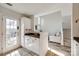 Bright kitchen area leading to a staircase and a door at 8929 Bryant Field Cir, Charlotte, NC 28277