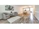 Spacious living area with wood floors, neutral paint, and a view of the dining area at 8929 Bryant Field Cir, Charlotte, NC 28277