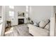Comfortable living room with a fireplace and large windows at 8929 Bryant Field Cir, Charlotte, NC 28277