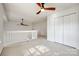 Second floor loft space featuring a ceiling fan, natural light, and a closet at 8929 Bryant Field Cir, Charlotte, NC 28277